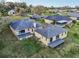 Back of home with a large yard, and a deck on each section of the house at 6327 Ashley Dr, Lakeland, FL 33813