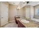 Bathroom featuring double sinks with granite countertops and a large mirror at 6327 Ashley Dr, Lakeland, FL 33813