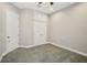 Cozy bedroom with neutral walls and carpet with closet and storage above the closet at 6327 Ashley Dr, Lakeland, FL 33813