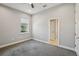 Neutral bedroom with grey carpet and window at 6327 Ashley Dr, Lakeland, FL 33813