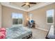 Bedroom features a sliding glass door that leads to a patio, and an adjoined workspace at 6327 Ashley Dr, Lakeland, FL 33813