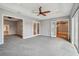 Spacious bedroom with neutral walls and carpet with doors leading to other rooms at 6327 Ashley Dr, Lakeland, FL 33813