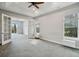 Spacious bedroom with neutral walls and carpet, doors leading to the outside deck at 6327 Ashley Dr, Lakeland, FL 33813