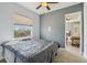 Comfortable bedroom featuring a ceiling fan and natural light from the window at 6327 Ashley Dr, Lakeland, FL 33813