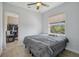 Bright bedroom featuring a ceiling fan and natural light from the window at 6327 Ashley Dr, Lakeland, FL 33813