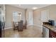 Bright dining area features tile flooring, a glass-topped table, and a view of the outdoors at 6327 Ashley Dr, Lakeland, FL 33813