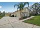 This home features a spacious driveway leading to attached and detached garages at 6327 Ashley Dr, Lakeland, FL 33813