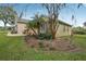 Landscaped front yard featuring mature trees and well-manicured lawn at 6327 Ashley Dr, Lakeland, FL 33813