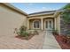 Home's entrance features columns, an arched window, and a brick walkway at 6327 Ashley Dr, Lakeland, FL 33813
