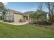 Well-maintained one-story home with stone accents, arched windows, and lush landscaping at 6327 Ashley Dr, Lakeland, FL 33813