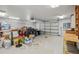 View of a three car garage, with storage and garage door opener at 6327 Ashley Dr, Lakeland, FL 33813