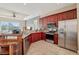 Kitchen features stainless steel appliances and dark wood cabinetry, along with granite countertops at 6327 Ashley Dr, Lakeland, FL 33813