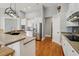 Bright kitchen with white cabinetry, stainless steel appliances, and hardwood floors at 6327 Ashley Dr, Lakeland, FL 33813