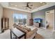 Spacious living room features a large window, tray ceiling, and comfortable seating at 6327 Ashley Dr, Lakeland, FL 33813