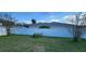 Backyard features a privacy fence and green grass at 1404 Country Chase Dr, Lakeland, FL 33810