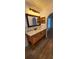 Cozy bathroom featuring a wood vanity, a large mirror, and wood-look tile flooring at 1404 Country Chase Dr, Lakeland, FL 33810