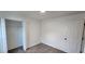 Simple carpeted bedroom with closet and white walls, offering a basic and functional living space at 1404 Country Chase Dr, Lakeland, FL 33810