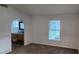 Bedroom featuring an en suite bathroom and windows to screened porch at 1404 Country Chase Dr, Lakeland, FL 33810