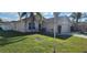 Charming single Gathering home featuring mature landscaping and a well maintained lawn at 1404 Country Chase Dr, Lakeland, FL 33810