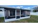 Enclosed screened porch provides a bug free outdoor living space at 1404 Country Chase Dr, Lakeland, FL 33810