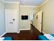 Bedroom boasts a TV, closet, and a doorway leading to the rest of the home at 8010 Tuscany Way # 5301, Davenport, FL 33896