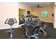 Community gym with exercise bikes, treadmills, and free weights for residents at 8010 Tuscany Way # 5301, Davenport, FL 33896