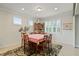 Charming dining room with a wooden table, seating for six, and plantation shutters on the windows at 9761 Sw 74Th Pl, Ocala, FL 34481