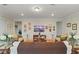 Living room with tile flooring, neutral paint and decoratively adorned walls at 9761 Sw 74Th Pl, Ocala, FL 34481