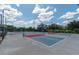 Outdoor pickleball courts with blue and red surfaces, providing a fun recreational activity at 9761 Sw 74Th Pl, Ocala, FL 34481