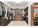 Spacious walk-in closet with custom shelving and storage solutions at 9761 Sw 74Th Pl, Ocala, FL 34481