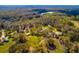 Sprawling property with lush trees and green lawns, complemented by multiple buildings at 4942 Cr 300, Lake Panasoffkee, FL 33538