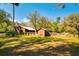 Rustic barn and shed with a cow in the pasture, perfect for rural living at 4942 Cr 300, Lake Panasoffkee, FL 33538