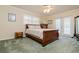 Cozy bedroom features wooden furniture, shutters and a ceiling fan for maximum comfort at 4942 Cr 300, Lake Panasoffkee, FL 33538