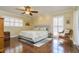 Comfortable bedroom with a ceiling fan and natural light, offering a peaceful retreat at 4942 Cr 300, Lake Panasoffkee, FL 33538
