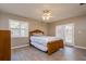 Inviting bedroom with shuttered windows and French doors, offers a tranquil retreat at 4942 Cr 300, Lake Panasoffkee, FL 33538