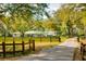 Estate home set back on the property, featuring a green metal roof and white exterior at 4942 Cr 300, Lake Panasoffkee, FL 33538