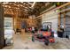 Interior of the garage with high ceilings and ample space for storage and equipment at 4942 Cr 300, Lake Panasoffkee, FL 33538