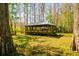 Charming backyard gazebo surrounded by lush greenery, offering a serene retreat at 4942 Cr 300, Lake Panasoffkee, FL 33538