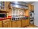 Gourmet kitchen features a Viking range, stainless steel hood, and decorative tile backsplash at 4942 Cr 300, Lake Panasoffkee, FL 33538