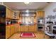 Gourmet kitchen with stainless steel appliances and custom cabinetry at 4942 Cr 300, Lake Panasoffkee, FL 33538