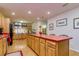 Large kitchen with island, stainless steel appliances and wood cabinets at 4942 Cr 300, Lake Panasoffkee, FL 33538