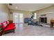 Bright living room with an exercise machine and a fireplace, offers a comfortable and healthy living space at 4942 Cr 300, Lake Panasoffkee, FL 33538