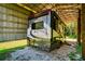This RV is protected from the elements within a sturdy storage structure with ample space and coverage at 4942 Cr 300, Lake Panasoffkee, FL 33538