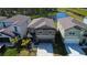 An aerial view capturing the home's position near a picturesque pond at 2244 Teneroc Trl, Lakeland, FL 33805