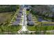 Aerial view of homes in a residential area with landscaped lawns and waterfront views in a community setting at 2244 Teneroc Trl, Lakeland, FL 33805