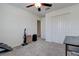 Bedroom featuring a ceiling fan and closet, plus a desk for multiple uses at 2244 Teneroc Trl, Lakeland, FL 33805