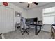 Bedroom featuring a ceiling fan, closet, and desk creating a functional and comfortable workspace at 2244 Teneroc Trl, Lakeland, FL 33805