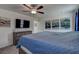 Spacious bedroom with a comfortable bed, dresser, and TV, creating a relaxing and inviting atmosphere at 2244 Teneroc Trl, Lakeland, FL 33805