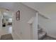 Bright hallway showcasing tile flooring and access to the carpeted stairs at 2244 Teneroc Trl, Lakeland, FL 33805