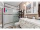 Bathroom featuring a shower, white vanity with drawers and a mirror cabinet at 520 S Orange Ave, Fort Meade, FL 33841